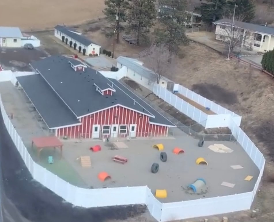 The Big Dog Barn and its fenced play yards from above